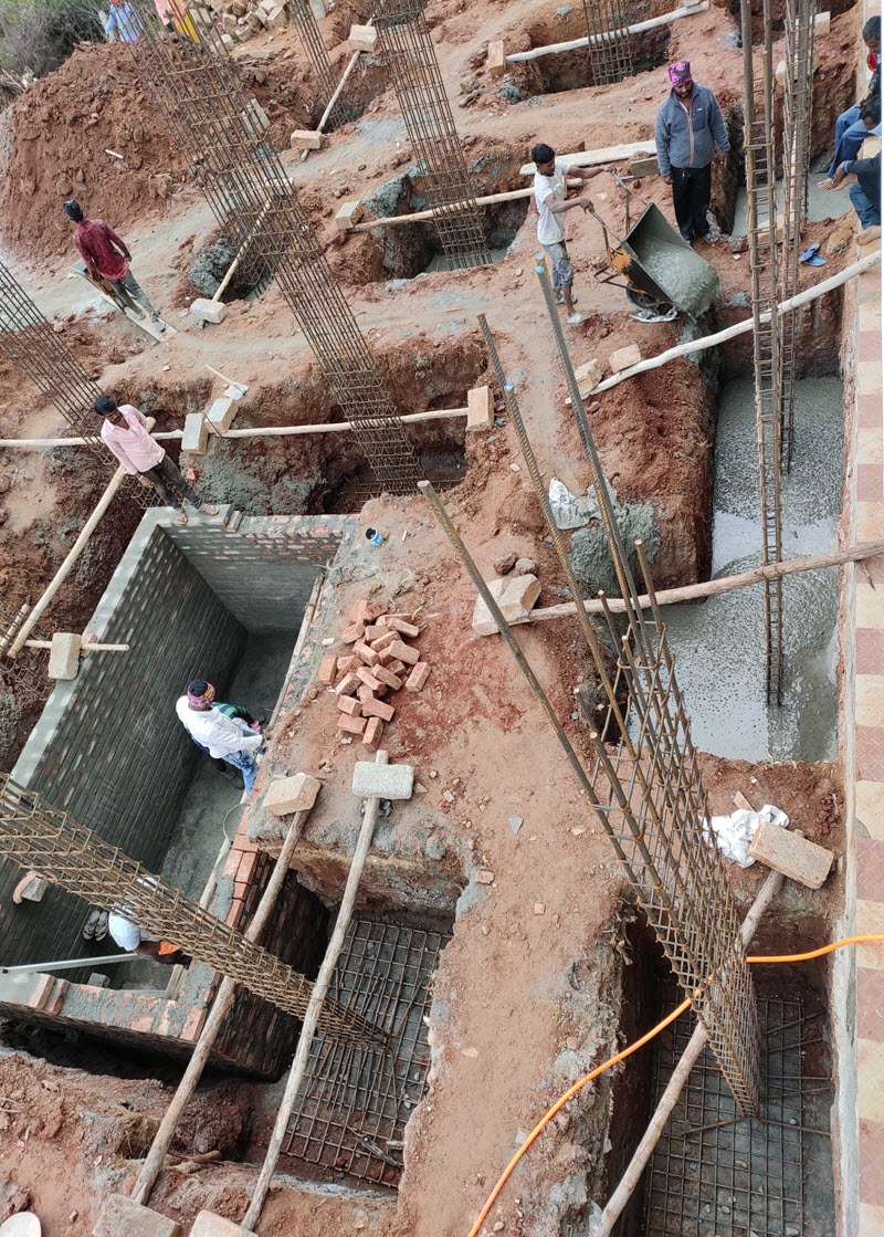 gang team pouring concrete inside trunch
