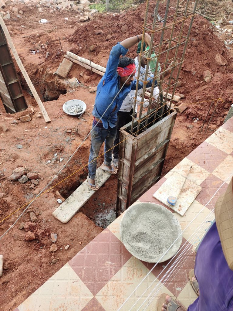 using vibrator to properly settle concrete