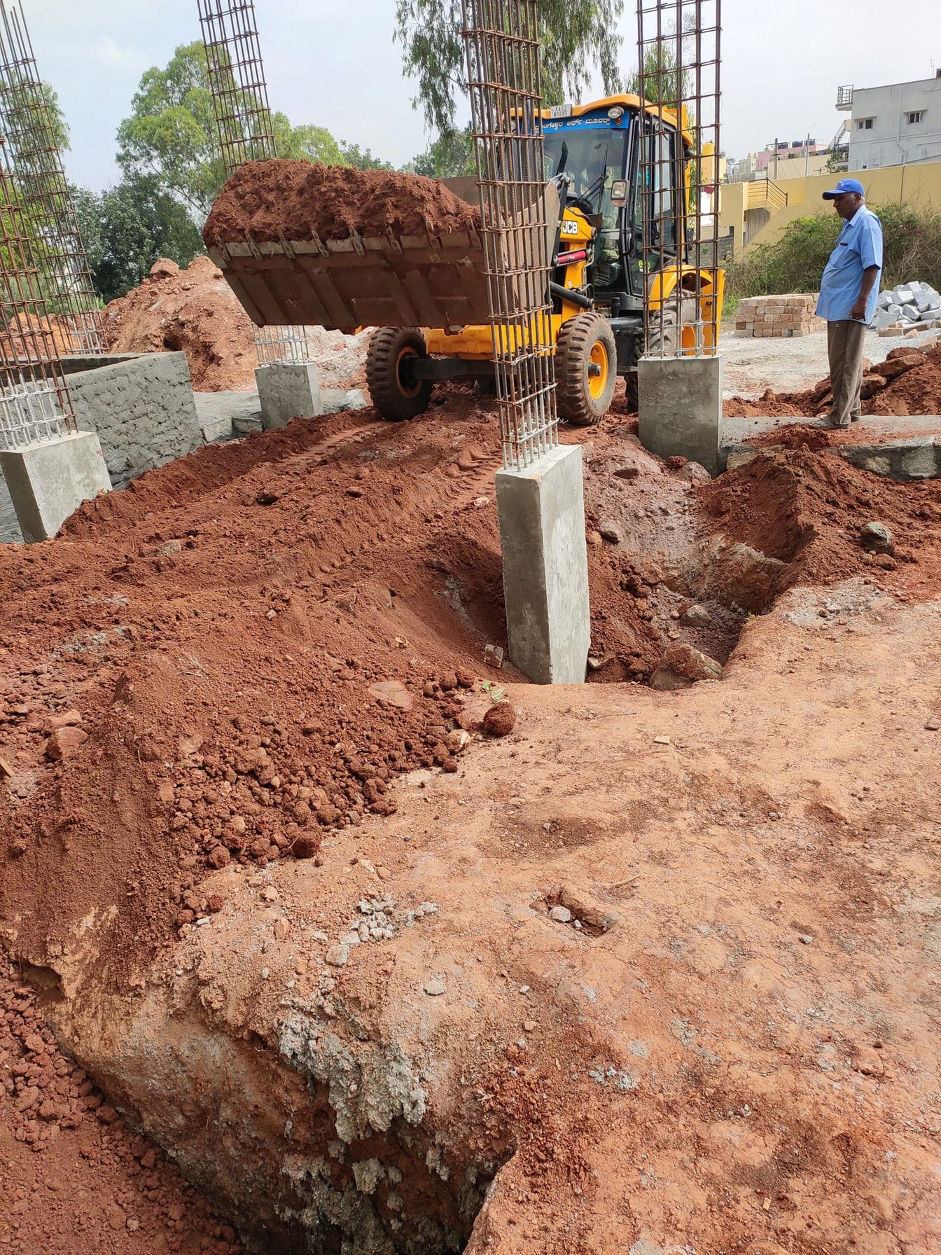 jcb filling soil inside the site
