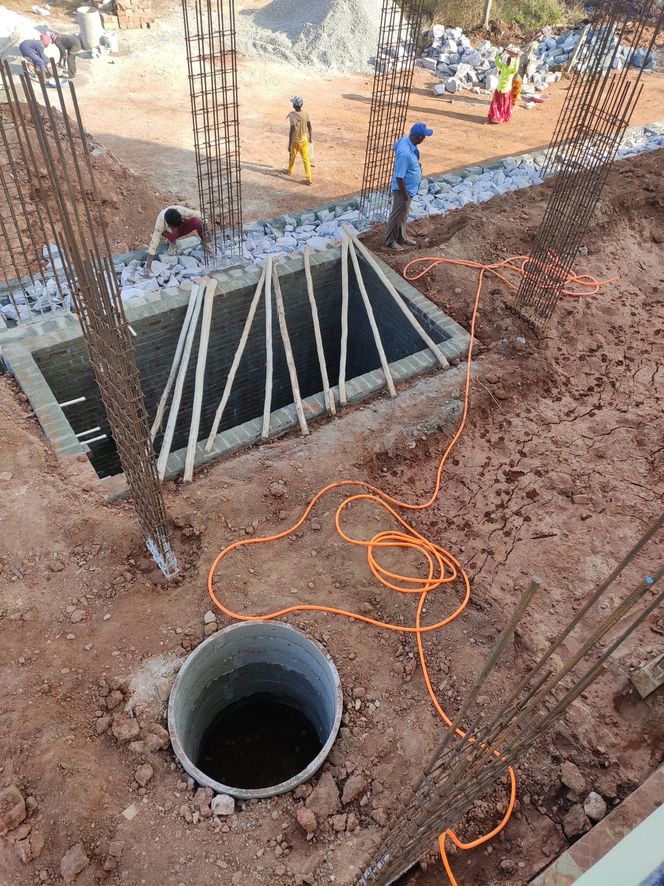 labourer raising size stone work