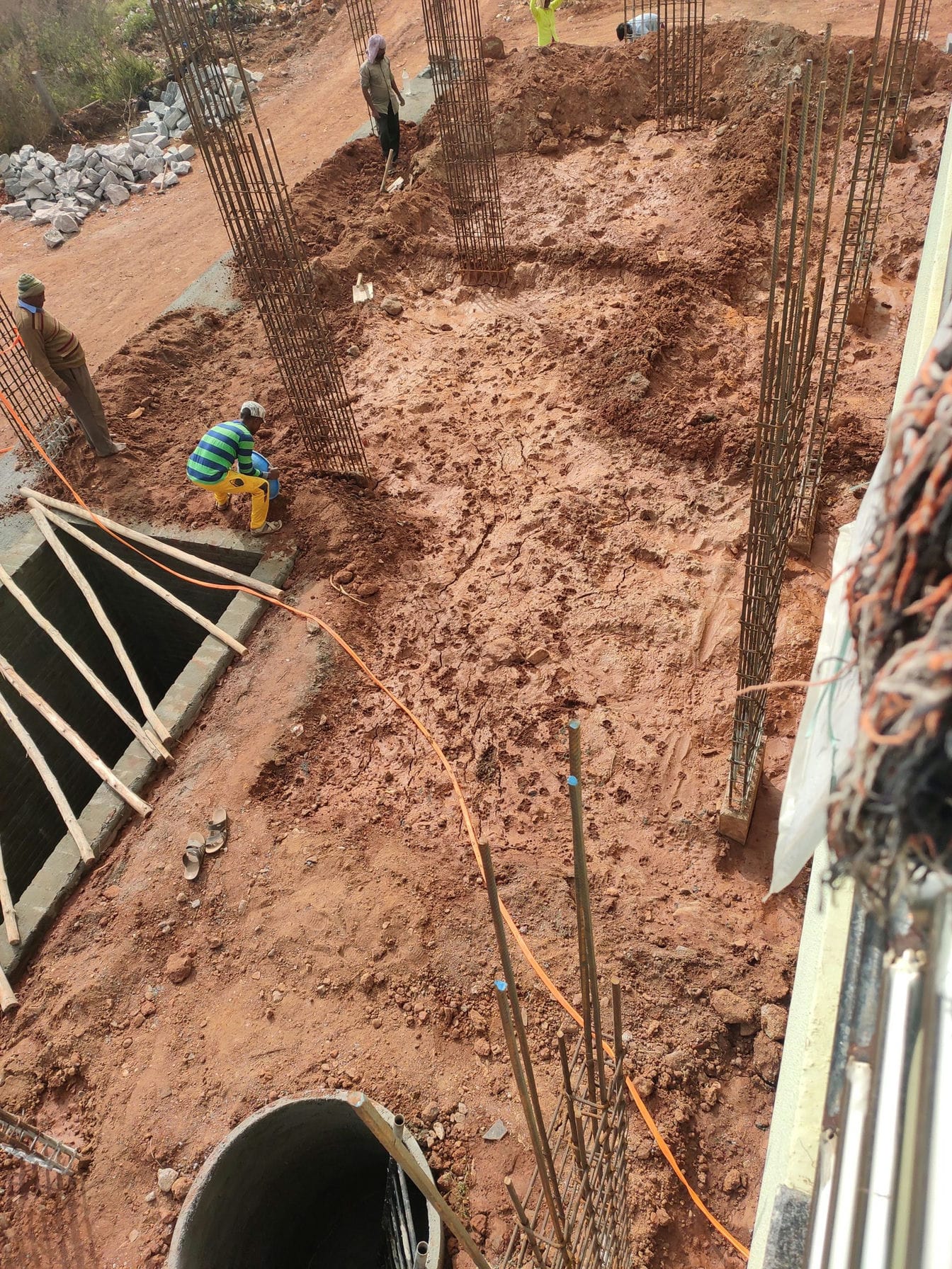 labourer doing boundries to stop water